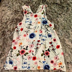 Flower tank-top. See through. Brand new. 1st picture (front). 2nd picture (back)